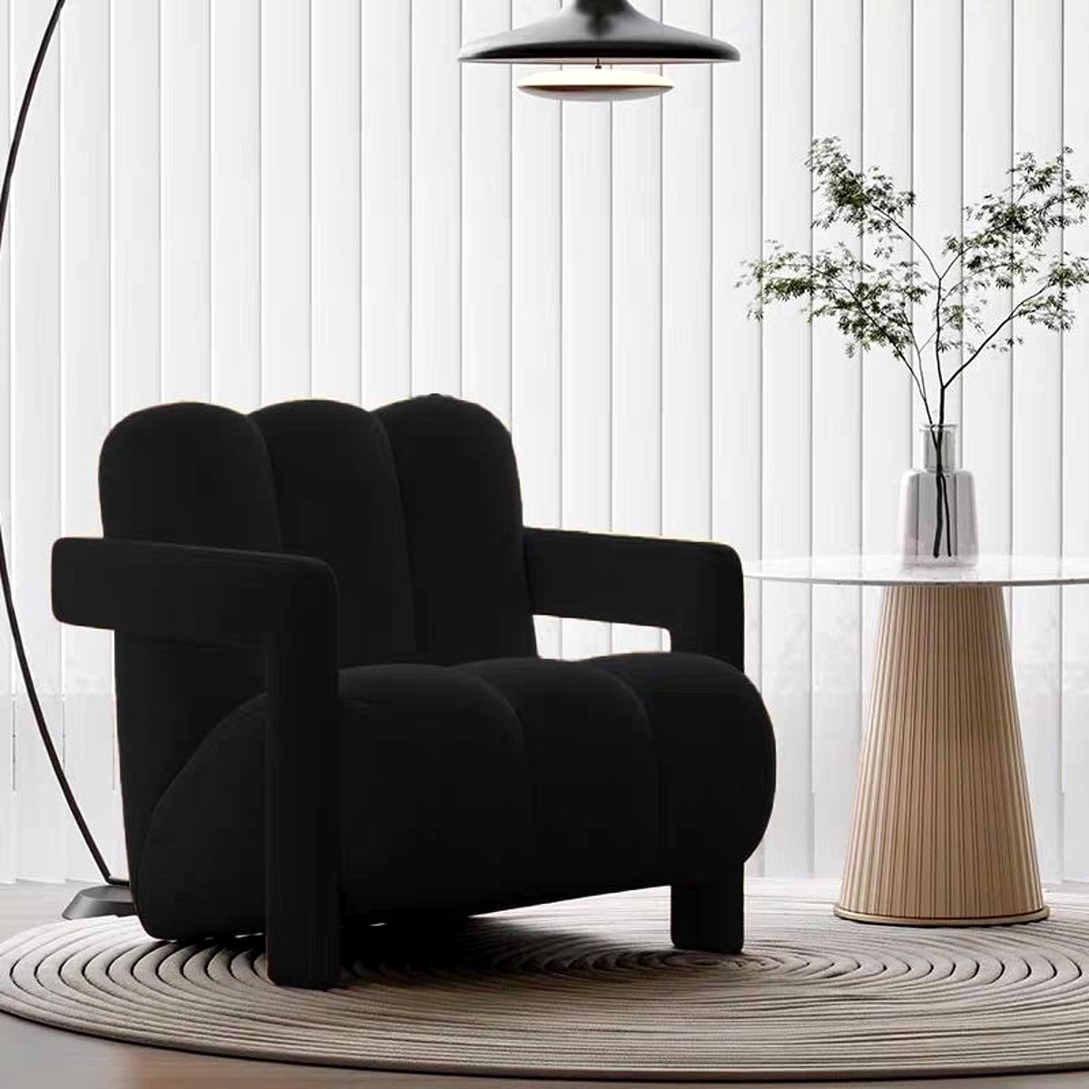 Fauteuil lounge à boudins en velours noir