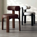 Fauteuil cocon en cuir, piètement bois massif