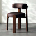Fauteuil cocon en cuir marron, piètement en bois massif